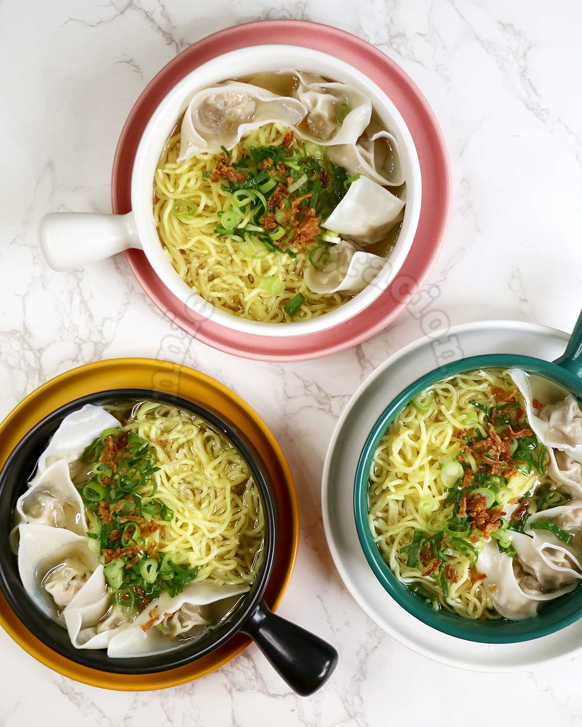 Three bowls of Chicken wonton noodle soup