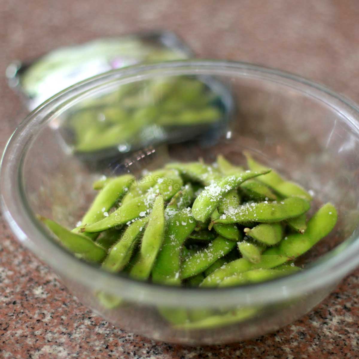 Edamame (fresh soy beans in pods) sprinkled with salt