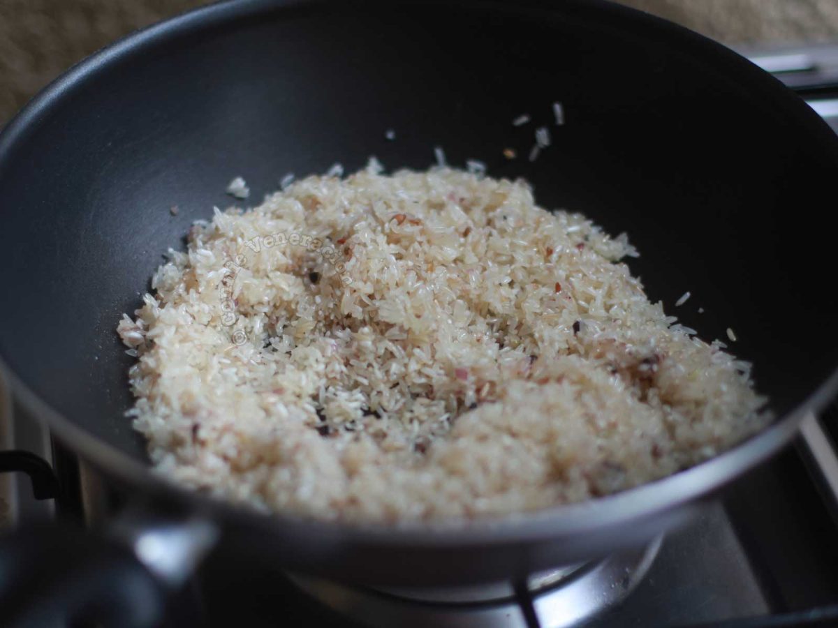 Tossing rice in sauteed spices