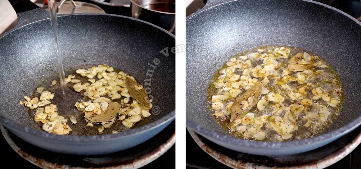 Pouring white wine into pan with with sauteed garlic, thyme and bay leaves