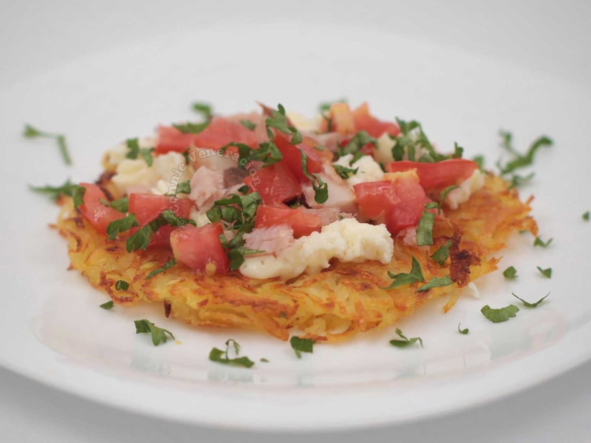Rosti salad (Swiss fried grated potatoes topped with tomatoes, crumbled feta and chopped smoky ham)
