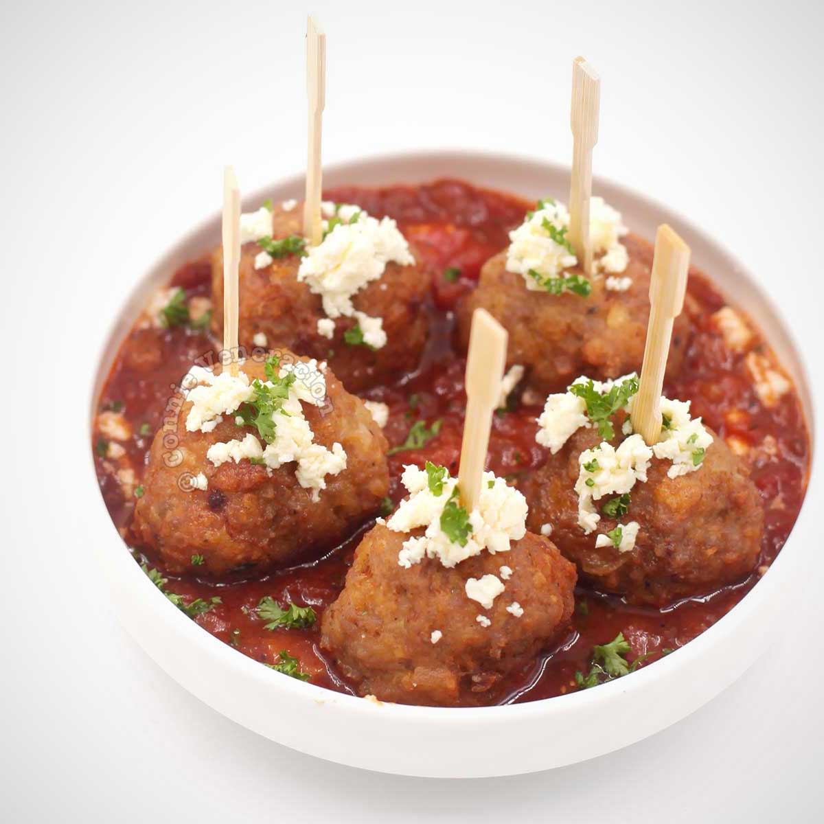 Spanish-style meatballs topped with crumbled feta