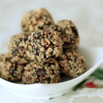 Dark chocolate truffles covered with crushed nuts