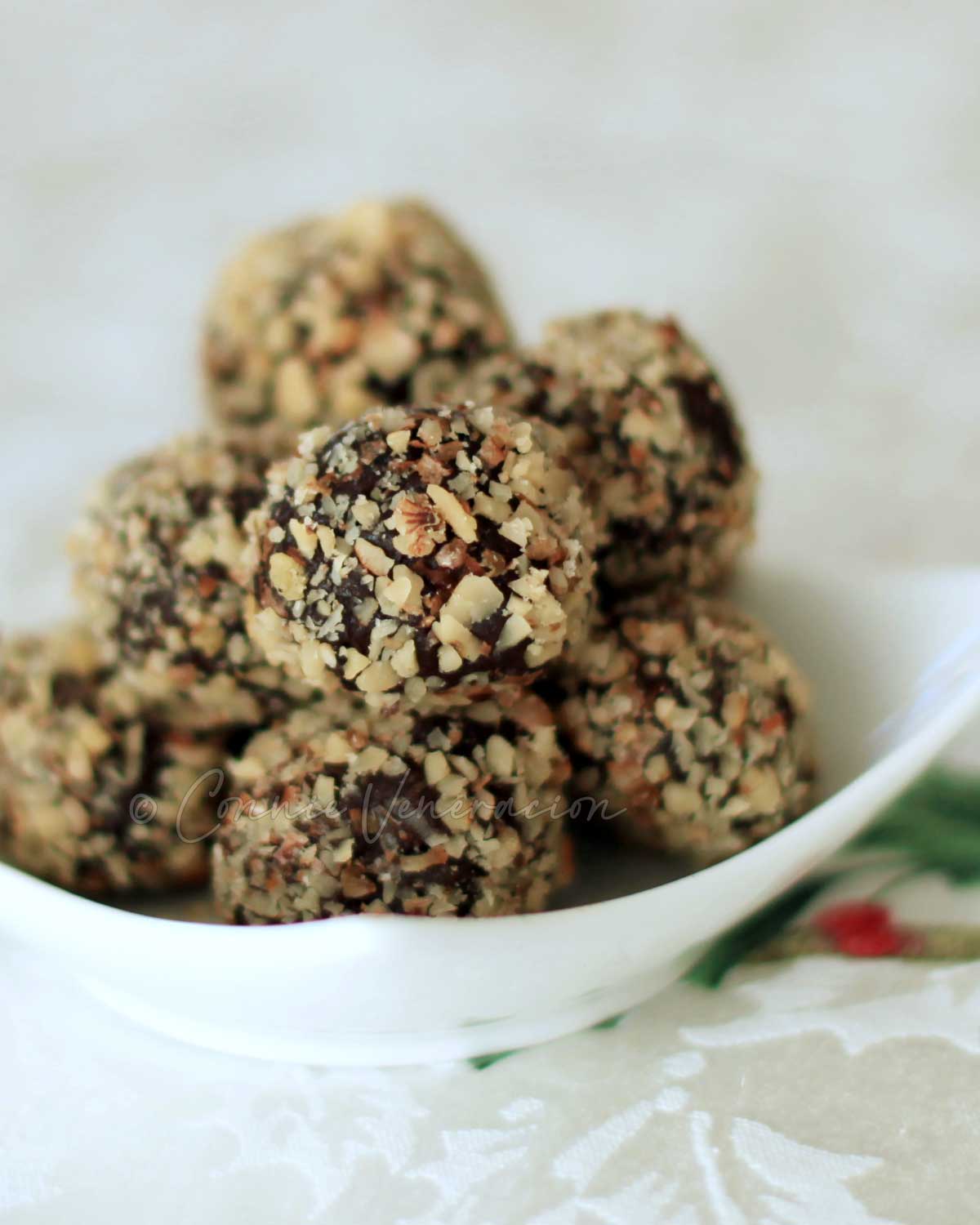 Dark chocolate truffles covered with crushed nuts
