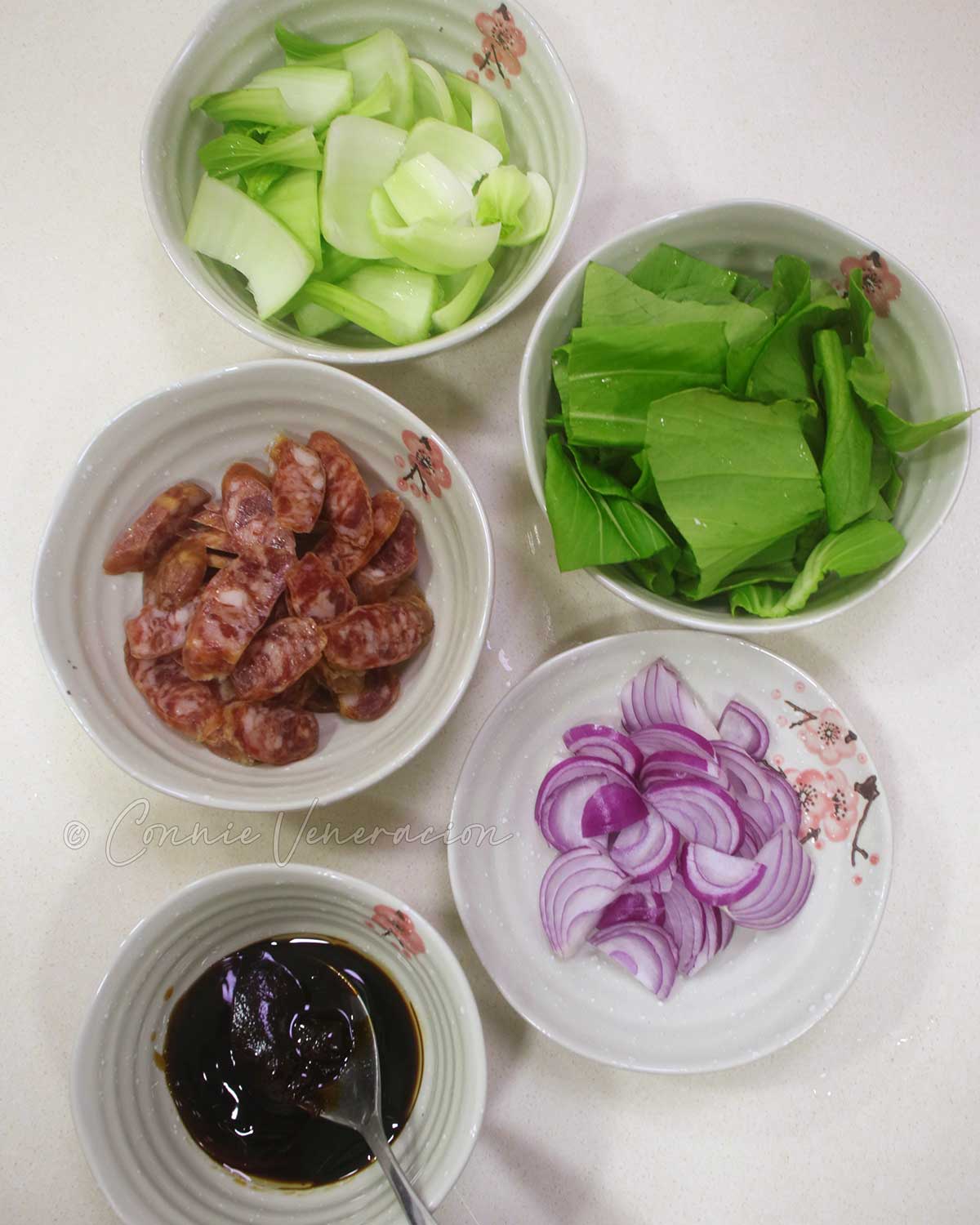 Bok choy, sliced Chinese sausage, sliced onion and sauce
