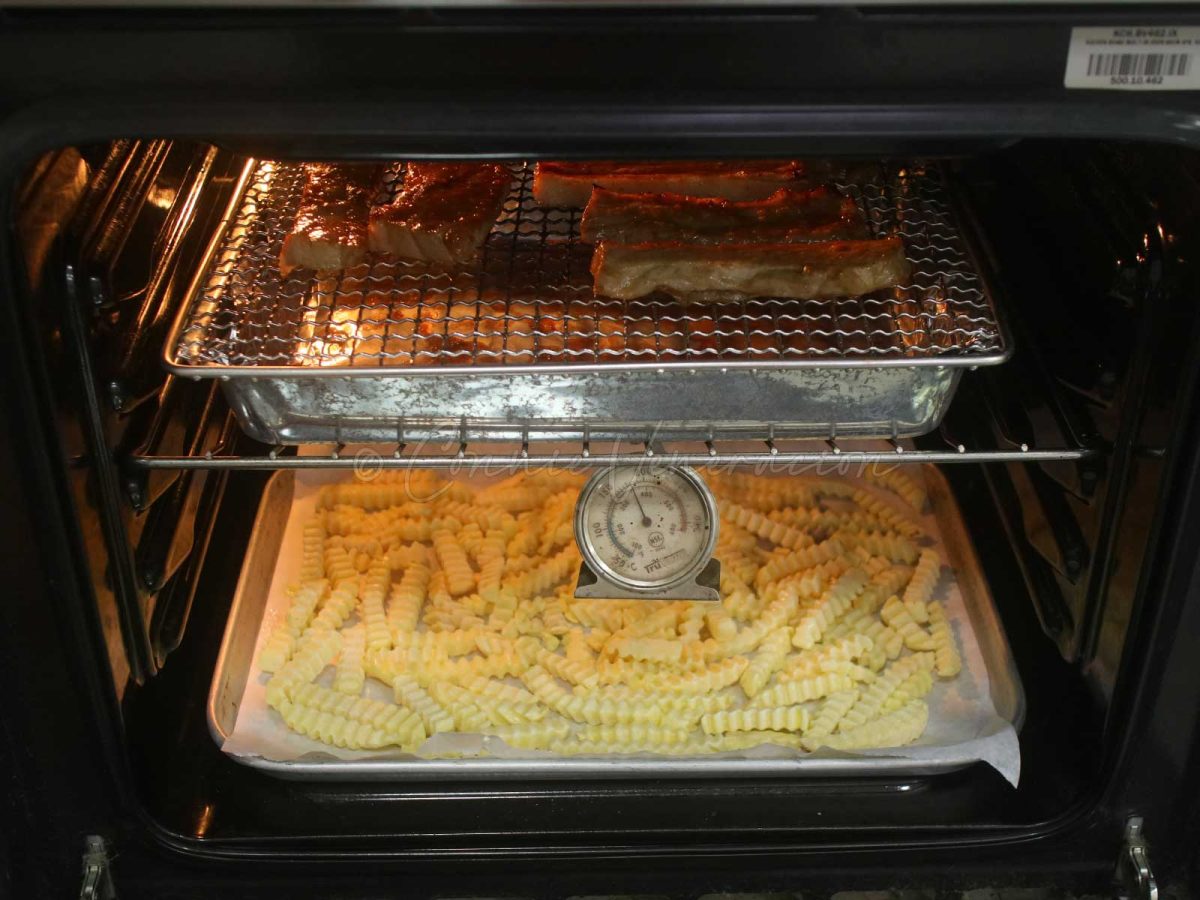 Broiling pork and fries in oven at the same time