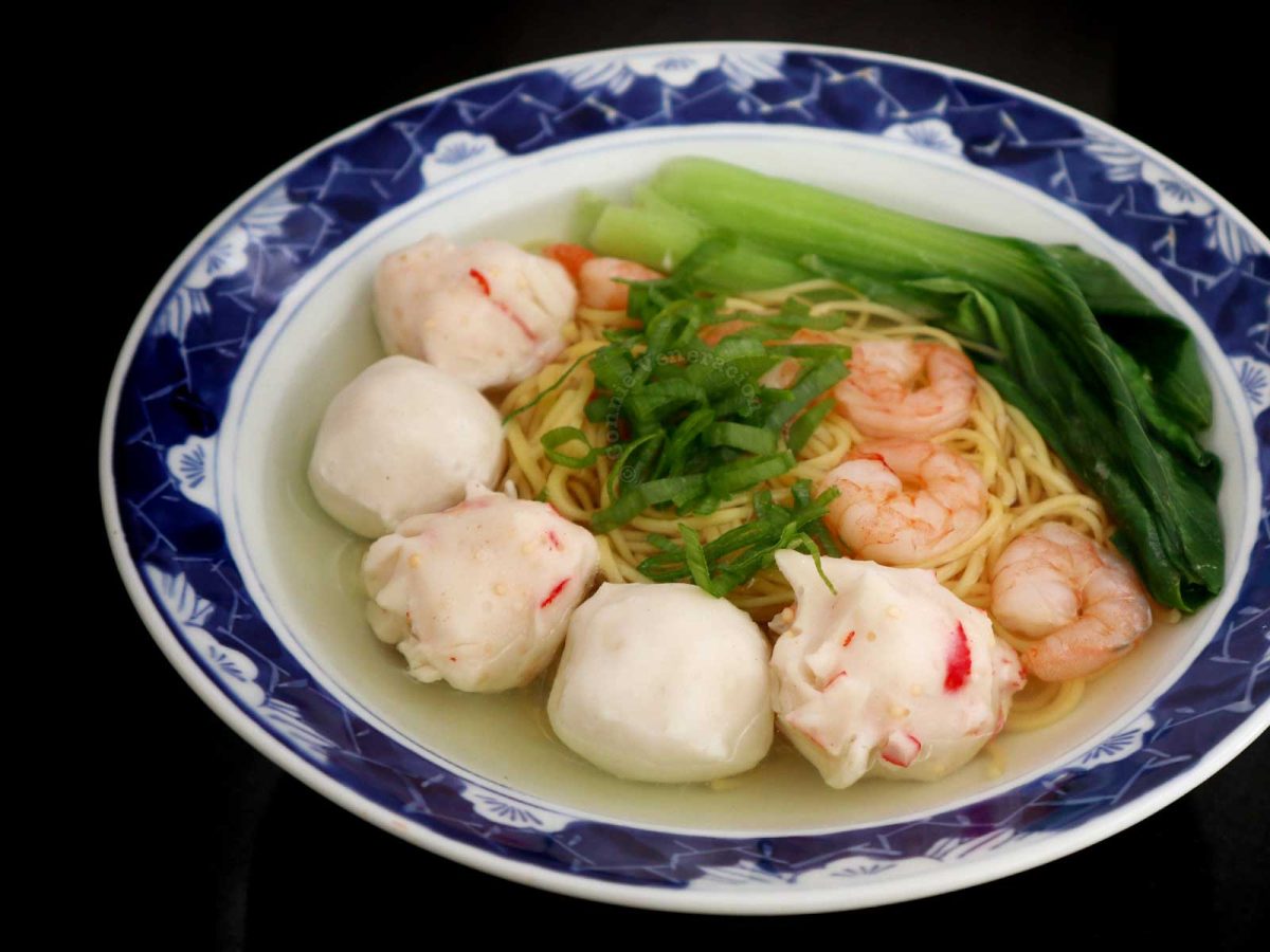Shrimp and fish ball ramen served with bok choy and scallions