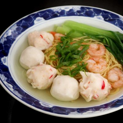 Shrimp and fish ball ramen served with bok choy and scallions