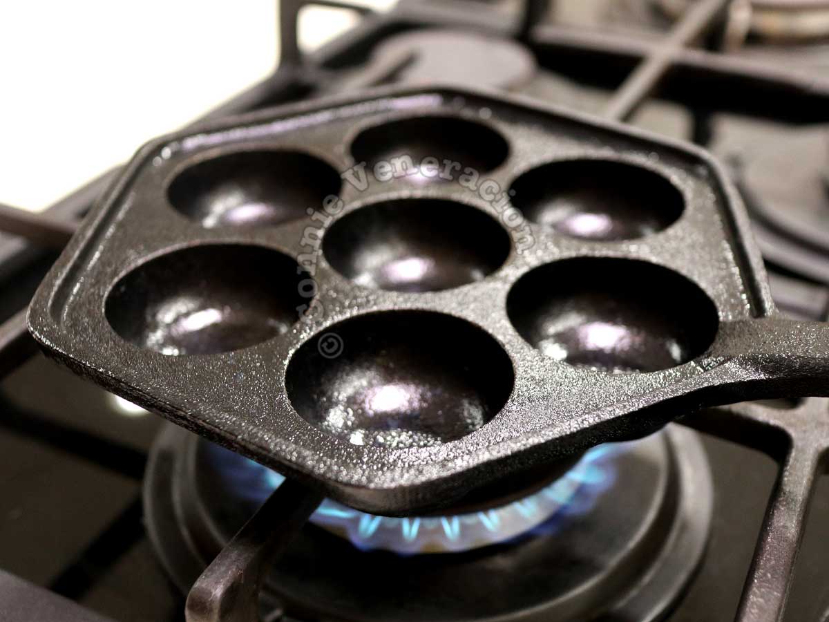 Heating aebleskiver pan on stove