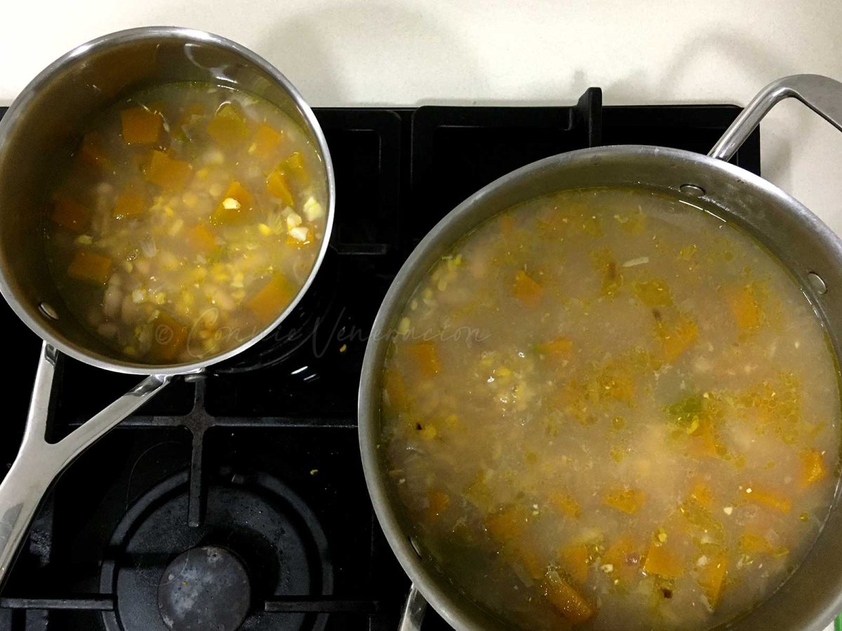 Corn, bean and squash soup in two pots on stove