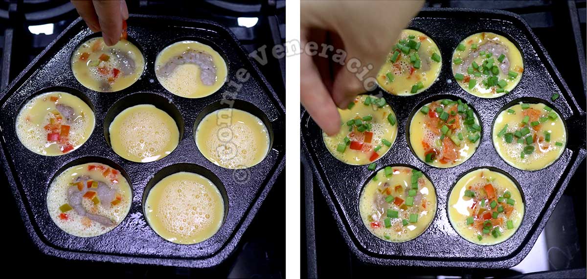 Topping eggs in aebleskiver pan with shrimps, sausagemeat and vegetables