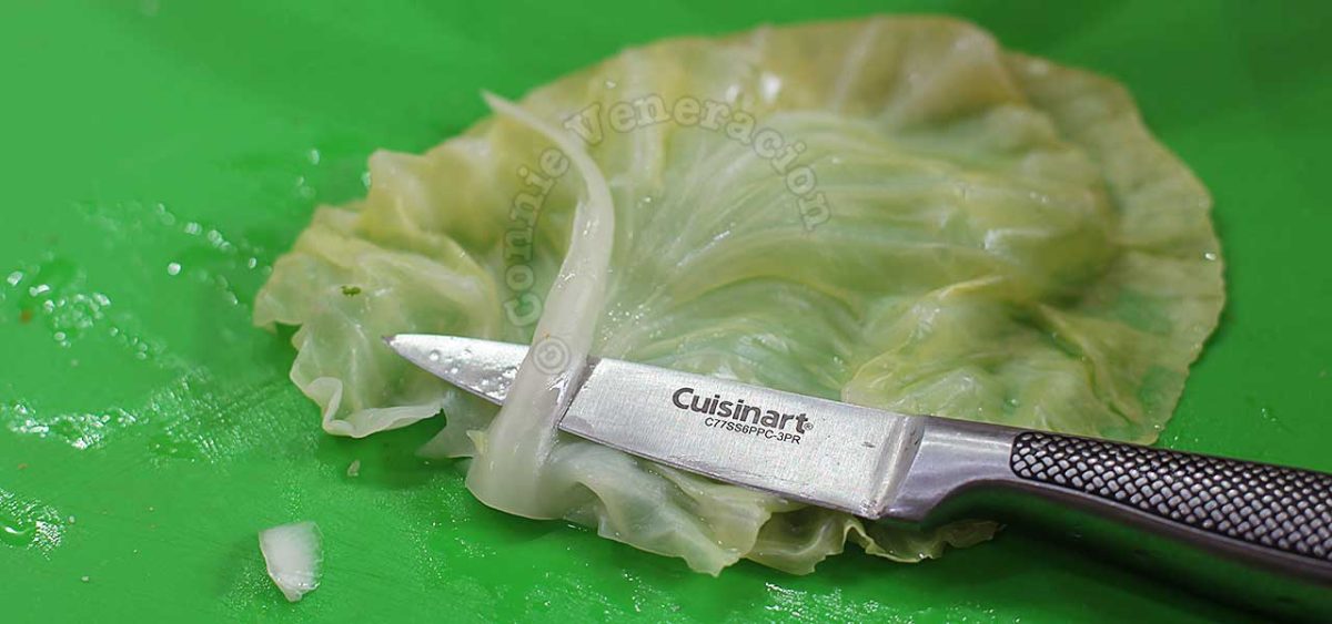 Trimming a softened cabbage leaf