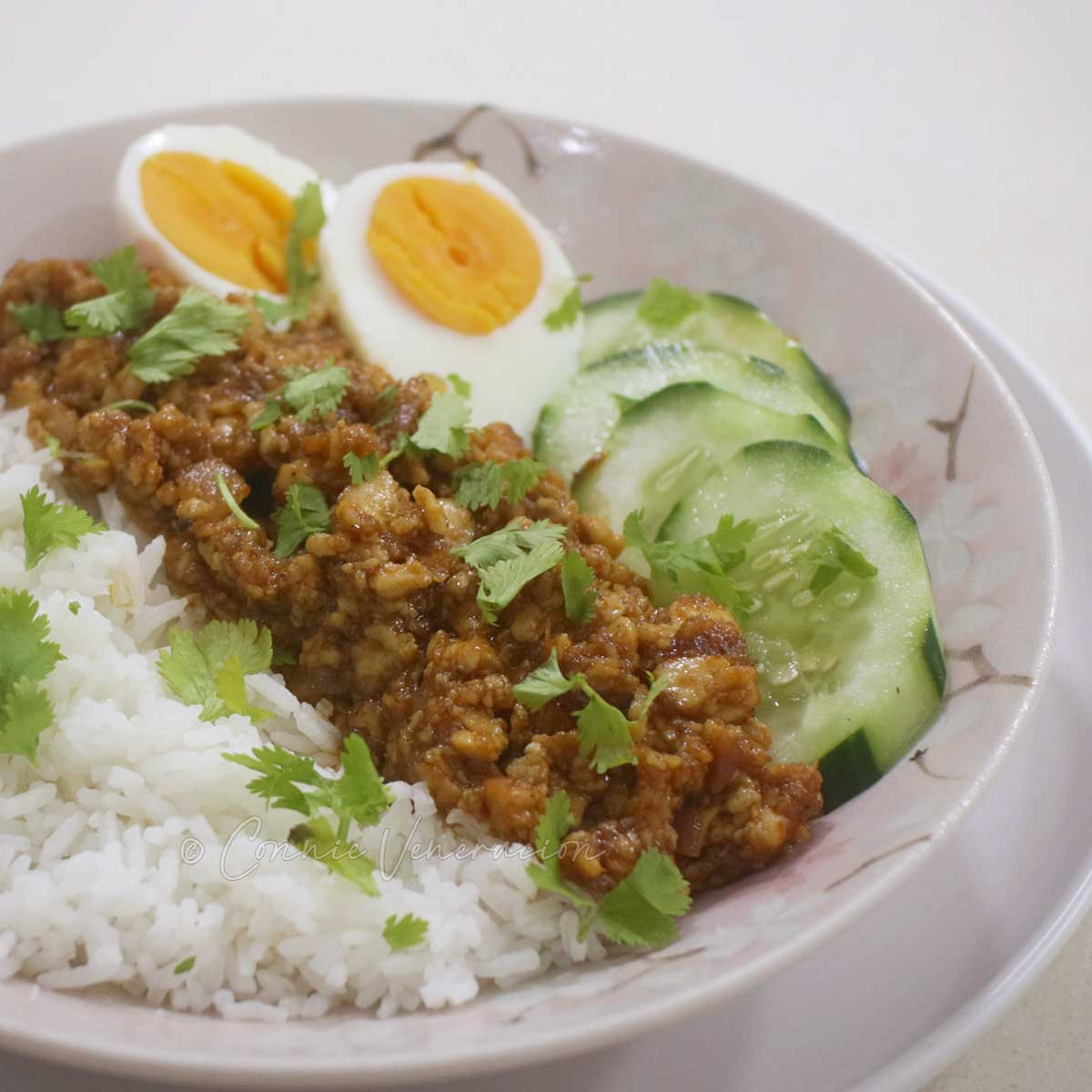 Tofu in BBQ sauce with rice, egg and sliced cucumber
