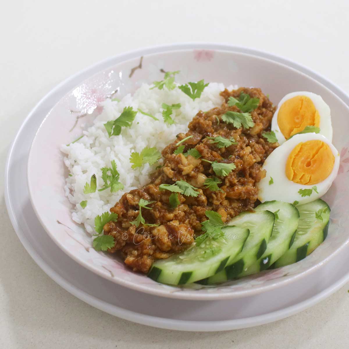 Tofu in BBQ sauce with rice, egg and sliced cucumber