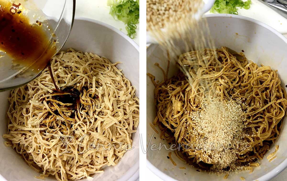 Tossing tofu skin noodles with sauce and toasted sesame seeds