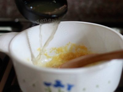 Making roux: pour liquid slowly into butter-flour mixture