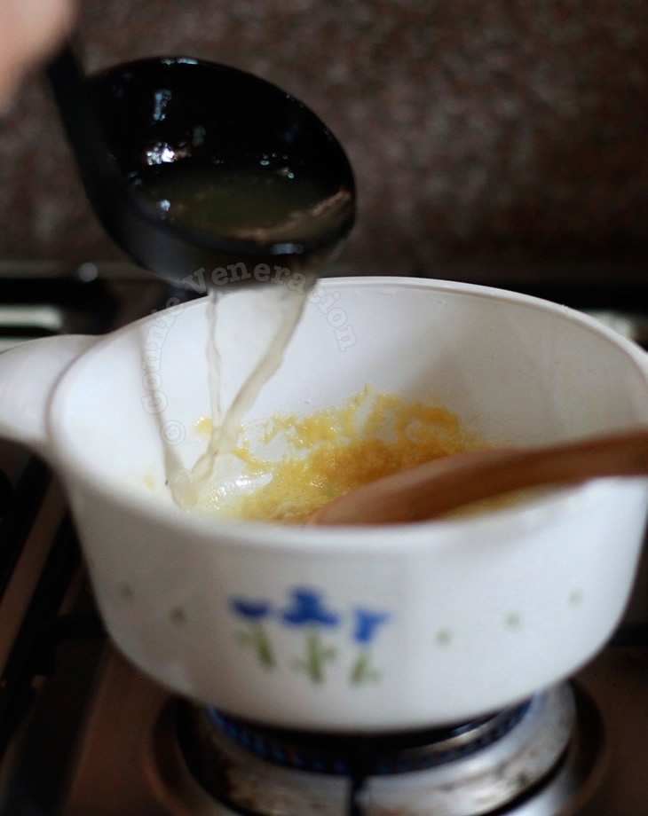 Making roux: pour liquid slowly into butter-flour mixture