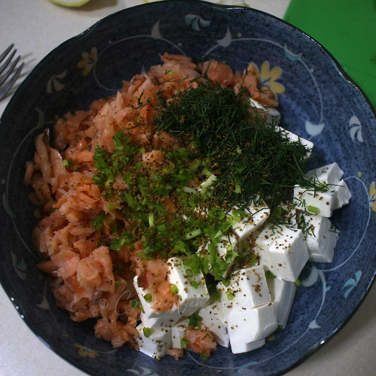 Chopped smoked salmon, cream cheese, dill and scallions in bowl