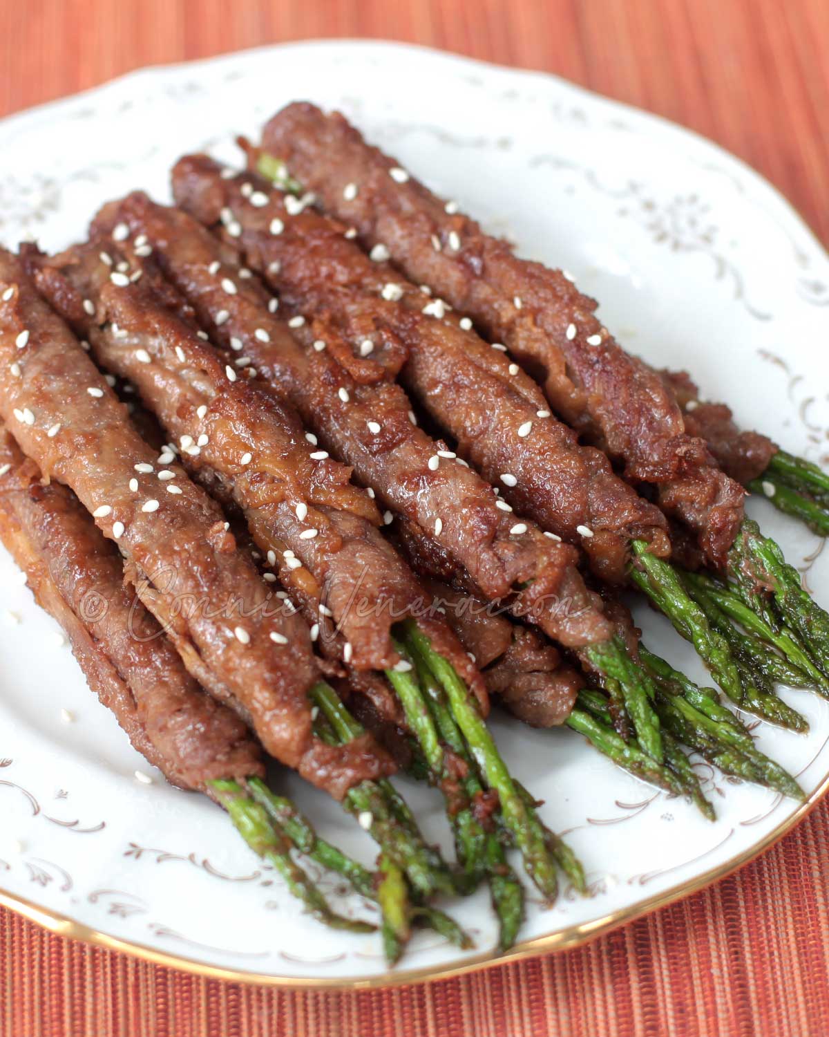 Beef and asparagus rolls with ginger teriyaki sauce