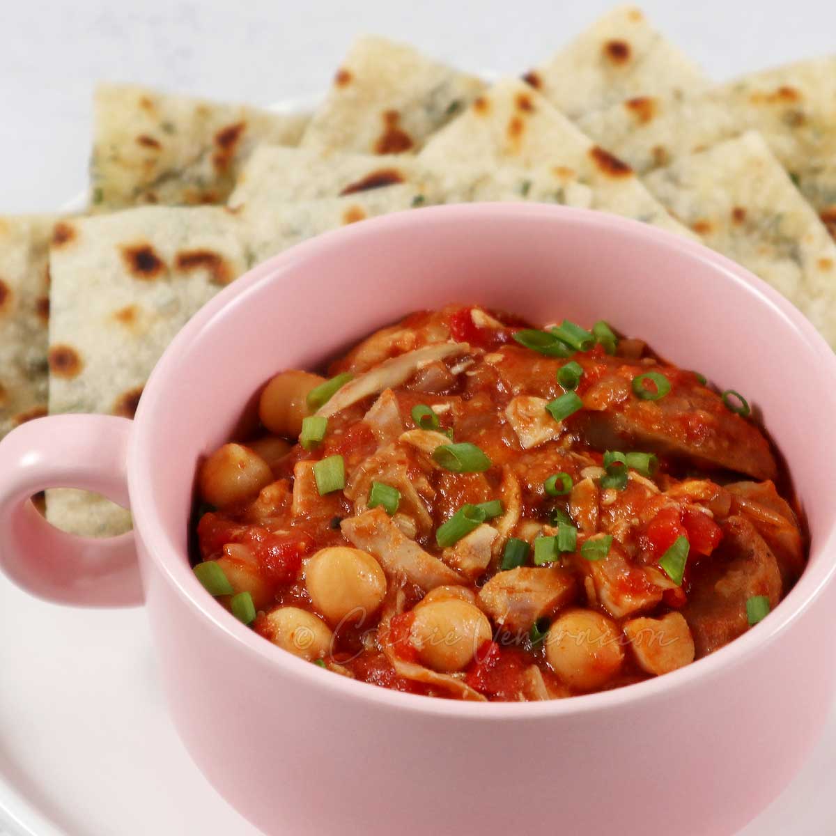 Chickpea stew cooked with leftover roast chicken.