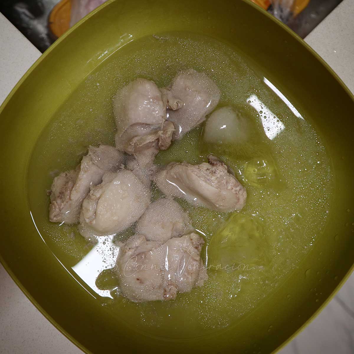Cooling poached chicken in iced water