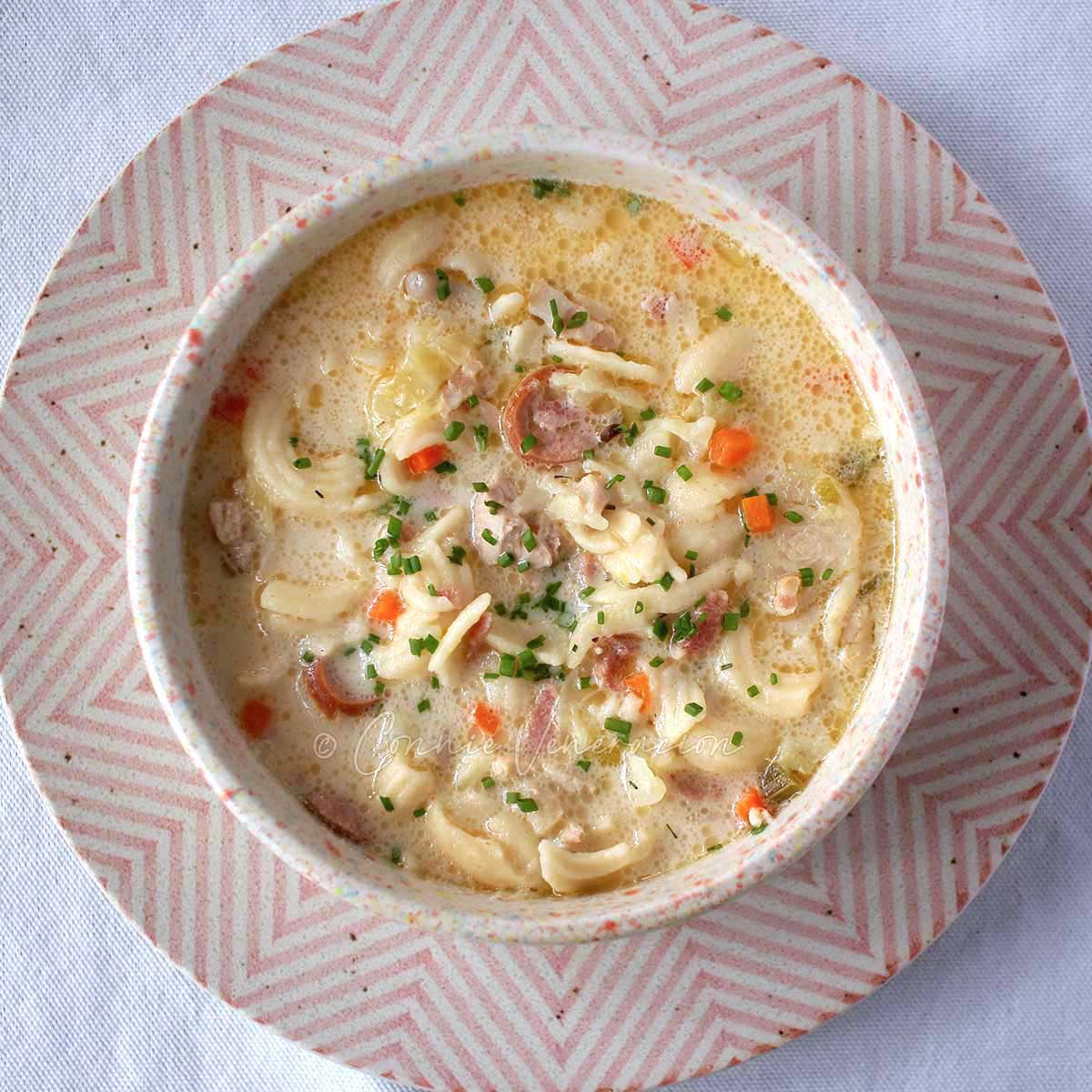 Creamy chicken and macaroni soup (Filipino sopas)