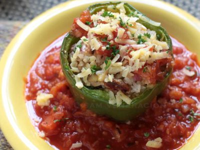 Baked bell pepper stuffed with rice, mushrooms and cheese
