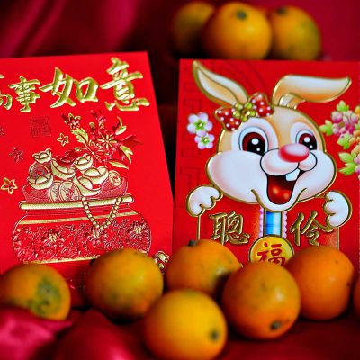 Lunar New Year staples: red envelopes and oranges