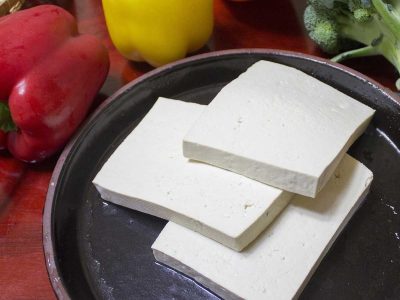 Slices of tofu on plate