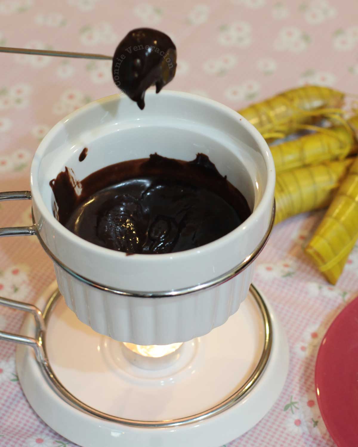 Dipping suman (Filipino sticky rice cakes) in chocolate