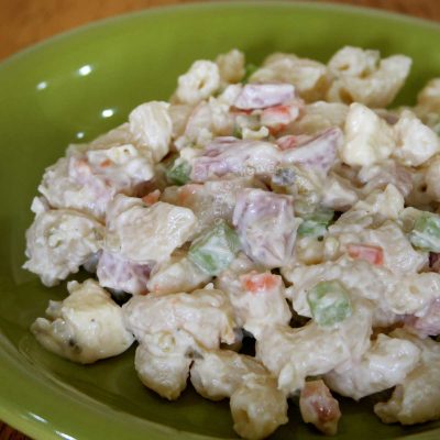 Macaroni salad with ham and cheese, carrot, celery, crushed pineapple, pickle relish and mayo
