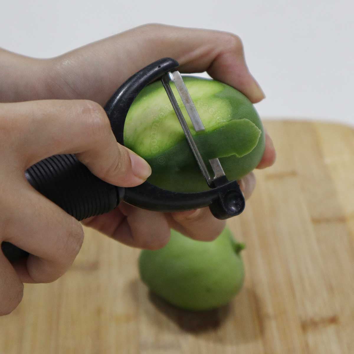 Peeling green mango