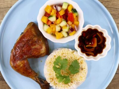 Chicken inasal with rice, dipping sauce and side salad