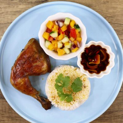 Chicken inasal with rice, dipping sauce and side salad