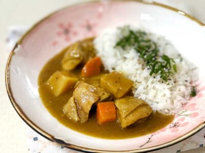 Japanese chicken curry and rice in shallow bowl