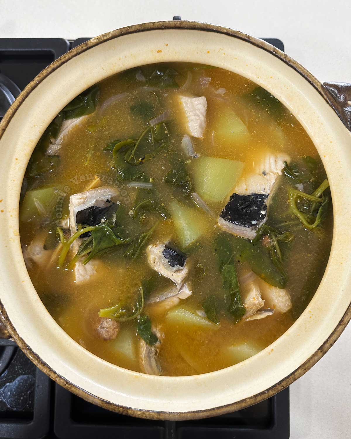 Gingered fish belly and vegetable soup (tinolang bangus) in claypot