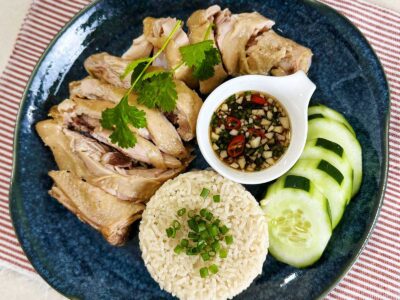 Lemongrass pandan chicken with rice, dipping sauce and cucumber slices