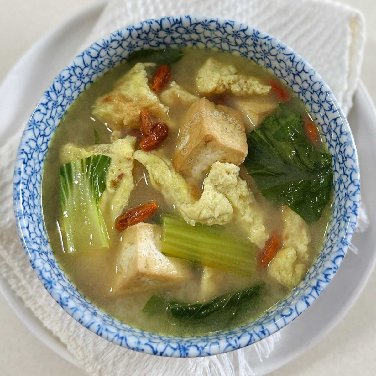 Tofu, egg and bok choy soup in sakura bowl