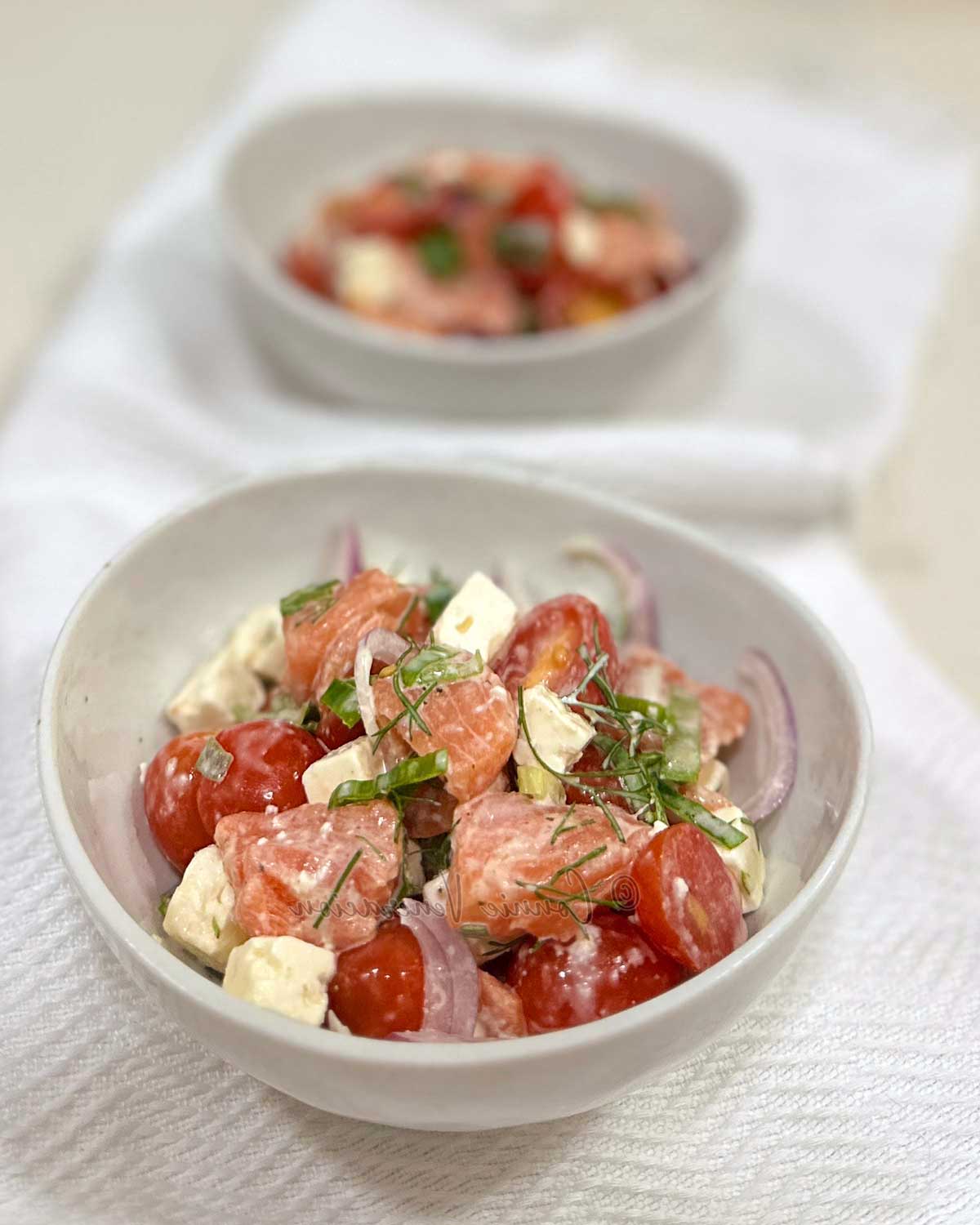 Salmon, tomato and cheese salad