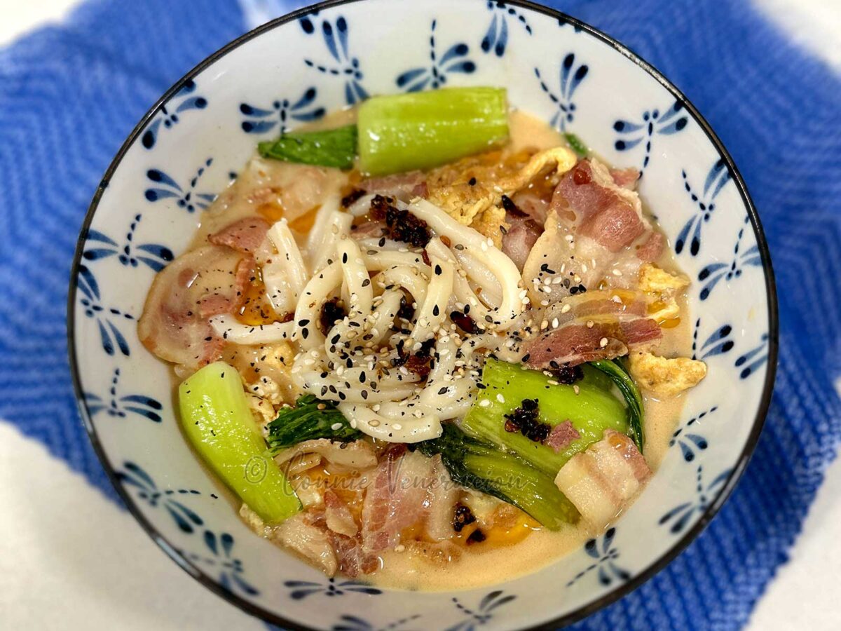 Bacon and egg udon soup with coconut cream and peanut butter
