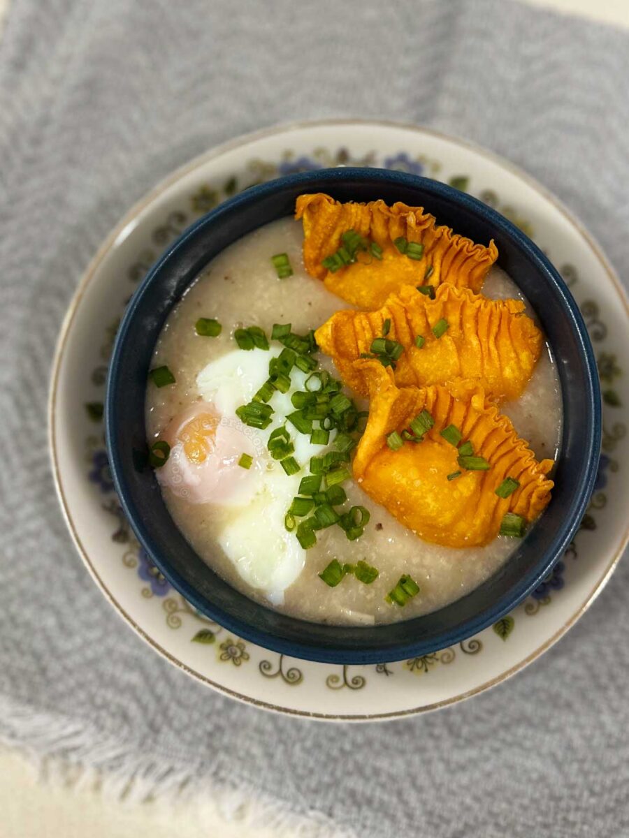 Congee with onsen egg, fried shrimp dumplings and scallions