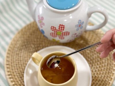 Stirring sugar into tea