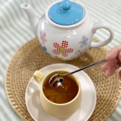 Stirring sugar into tea