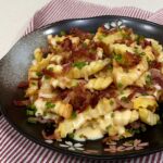 Air fried French fries smothered with bacon, cheese sauce and scallions