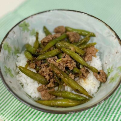 Ground pork and green beans adobo over rice