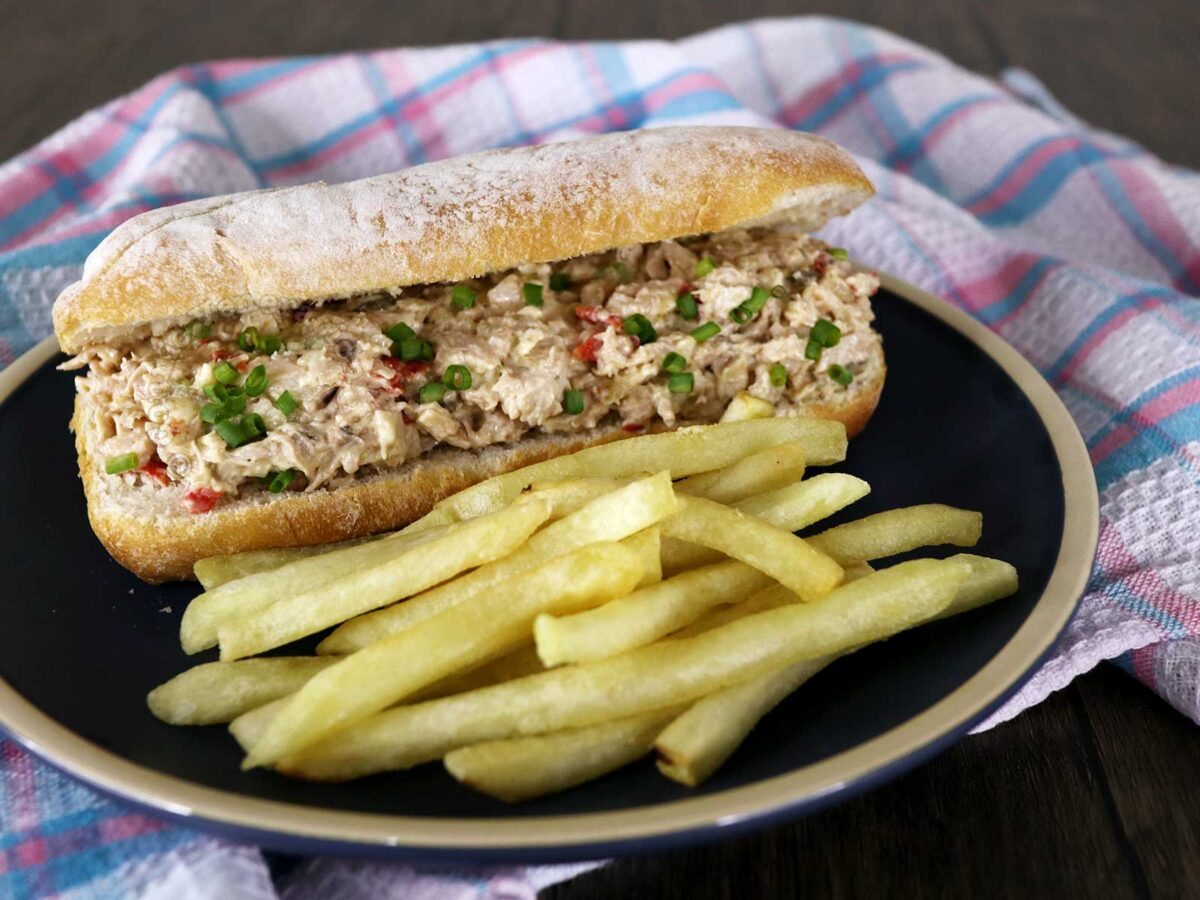 Chicken salad sandwich with fries on the side