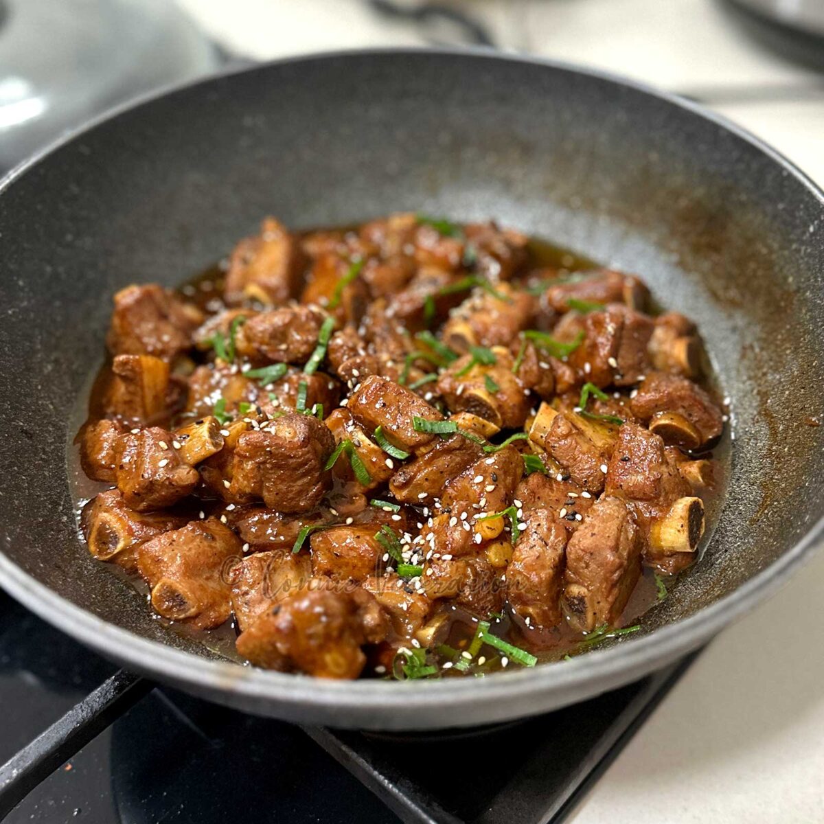 Stovetop soda braised pork ribs in wok