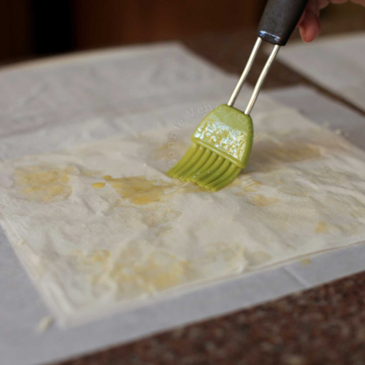 Brushing phyllo (fillo, filo) pastry with melted butter