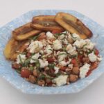 Sauteed chickpeas, green beans and tomatoes with crumbled feta