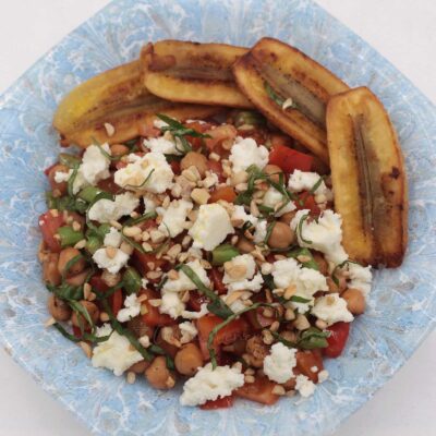 Sauteed chickpeas, green beans and tomatoes with crumbled feta
